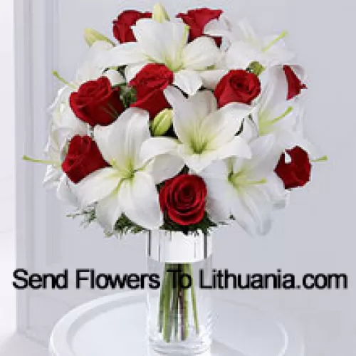 This product is a sleek and elegant way to spread goodwill for the holiday season. Red roses are set to catch the eye arranged amongst white Oriental lilies in a clear glass cylinder vase wrapped in silver ribbon to create a seasonal display of heartfelt wishes for a magical holiday. (Please Note That We Reserve The Right To Substitute Any Product With A Suitable Product Of Equal Value In Case Of Non-Availability Of A Certain Product)