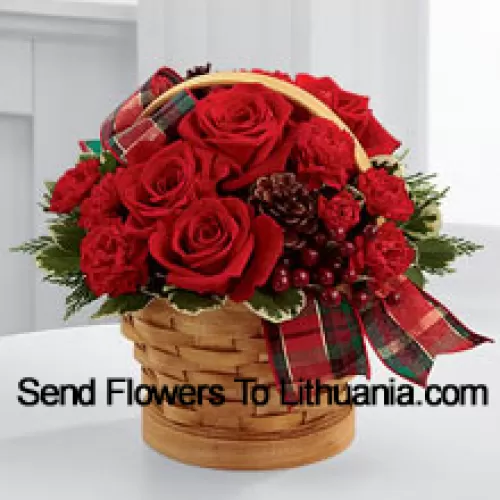 Greet your special recipient with seasonal beauty and blessings. Red roses and mini carnations are gorgeously arranged in a natural woodchip basket with assorted holiday greens, natural pinecones, and berry pics, accented with a tartan plaid ribbon to create a gift that wishes everything this wondrous season has to offer (Please Note That We Reserve The Right To Substitute Any Product With A Suitable Product Of Equal Value In Case Of Non-Availability Of A Certain Product)